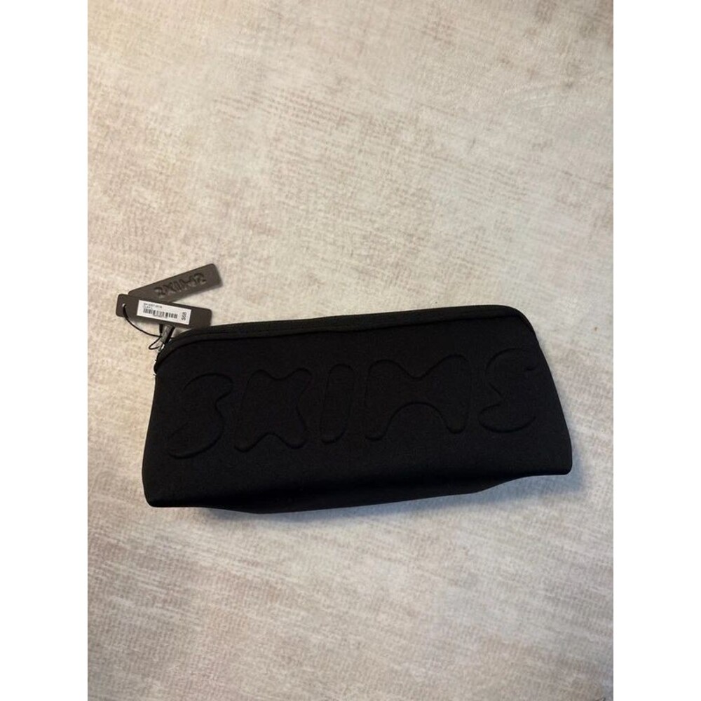 SKIMS travel case storage